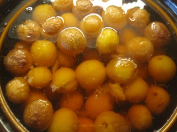 Cooked plums and water.